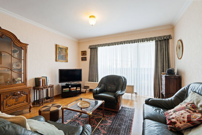 This spacious 2-bedroom apartment, featuring 2 terraces, a private garage box, and a parking space, is located on the third floor of a well-maintained residential building.

LAYOUT:
The entrance hall leads to a bright living room with a dining area and a 