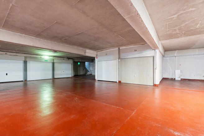 This spacious 2-bedroom apartment, featuring 2 terraces, a private garage box, and a parking space, is located on the third floor of a well-maintained residential building.

LAYOUT:
The entrance hall leads to a bright living room with a dining area and a 