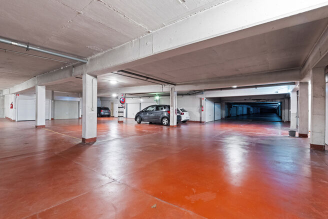 This spacious 2-bedroom apartment, featuring 2 terraces, a private garage box, and a parking space, is located on the third floor of a well-maintained residential building.

LAYOUT:
The entrance hall leads to a bright living room with a dining area and a 
